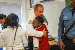 Lt. Eickhoff connects with students during a Secret Santa shop. Lt. Eickhoff connects with students during a Secret Santa shop.