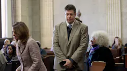 Jason Van Dyke walks past several attorneys including Assistant Attorney General Barbara Greenspan, right, on his way to the bench. Former police officer Jason Van Dyke with his attorney Dan Herbert stands in front of Judge Vincent Gaughan at the Leighton Criminal Courts Building on Thursday, December 8, 2016 for a hearing on the shooting death of Laquan McDonald in Chicago.