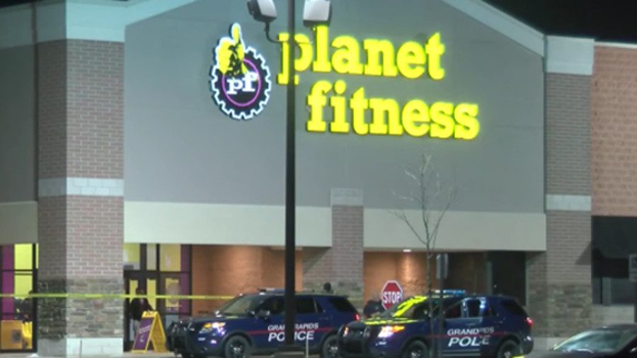 An FBI special agent fired three shots at a Grand Rapids police sergeant outside a Planet Fitness early Tuesday morning.
