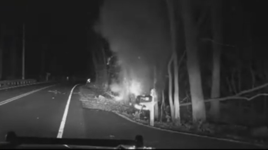Wilton police officers saved a man who was trapped in a burning car and the entire rescue was captured by a cruiser dashboard camera.