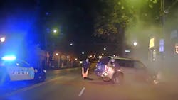 Norwood police officers pulled Ryan Brown from his burning vehicle after he wrecked it during a pursuit early Tuesday morning. Norwood police officers pulled Ryan Brown from his burning vehicle after he wrecked it during a pursuit early Tuesday morning.