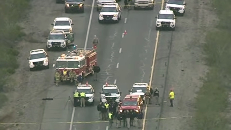 Officials say the passerby went back to his car, grabbed a gun and fatally shot the suspect after he failed to obey his commands to stop attacking the trooper.