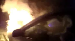 Watch Dramatic Rescue of Officer Saving Woman From Burning Car