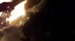 Raw: Officer Helps Woman Escape Burning Car