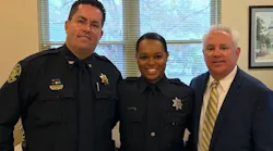 Berkeley County Sheriff's Cpl. Kimber Gist, center, is flanked by Chief Deputy Mike Cochran and Sheriff Duane Lewis on her return to full duty Tuesday.