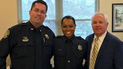 Berkeley County Sheriff&apos;s Cpl. Kimber Gist, center, is flanked by Chief Deputy Mike Cochran and Sheriff Duane Lewis on her return to full duty Tuesday.