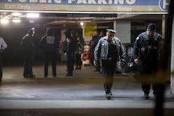 Chicago Police guard the scene of a shooting involving multiple victims, including an off-duty police officer, inside a parking garage on the 1200 Block of North State Parkway on Jan. 28. Chicago Police guard the scene of a shooting involving multiple victims, including an off-duty police officer, inside a parking garage on the 1200 Block of North State Parkway on Jan. 28.