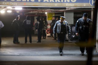 Chicago Police guard the scene of a shooting involving multiple victims, including an off-duty police officer, inside a parking garage on the 1200 Block of North State Parkway on Jan. 28.