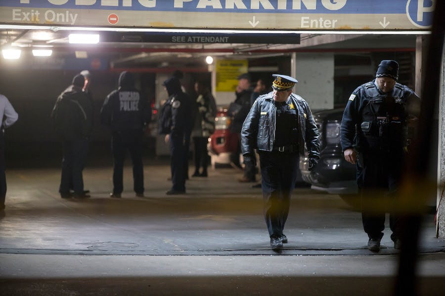 Chicago Police guard the scene of a shooting involving multiple victims, including an off-duty police officer, inside a parking garage on the 1200 Block of North State Parkway on Jan. 28.