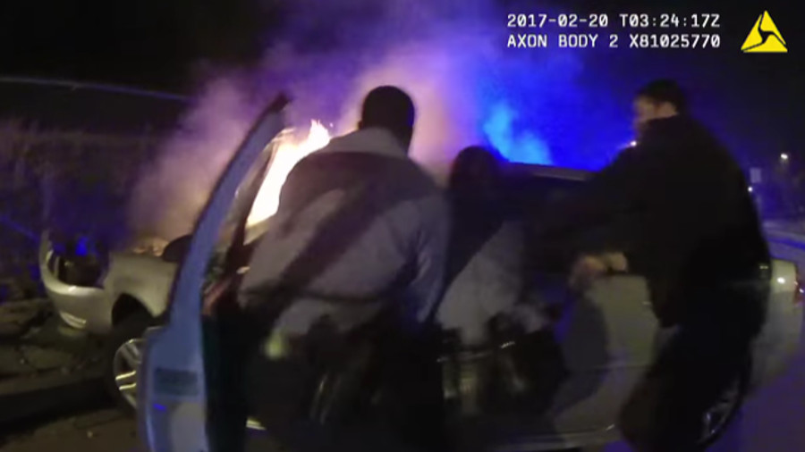 Dramatic body camera video has been released of D.C. police officers pulling a man out of a burning car following a wreck Sunday night.