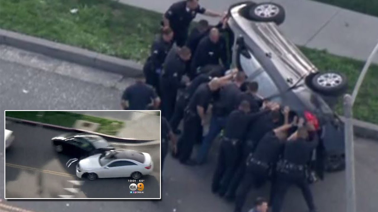 Officers Rescue Woman From Her Car After It Flipped Over During Chase
