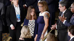 Susan Oliver, the widow of a California sheriff's deputy who was murdered allegedly by a twice deported illegal immigrant, stands with her daughter Jenna during President Donald J. Trump's first address to a joint session of Congress on on Feb. 28 at the Capitol in Washington, D.C.