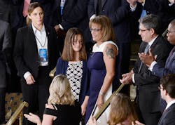 Susan Oliver, the widow of a California sheriff&apos;s deputy who was murdered allegedly by a twice deported illegal immigrant, stands with her daughter Jenna during President Donald J. Trump&apos;s first address to a joint session of Congress on on Feb. 28 at the Capitol in Washington, D.C.