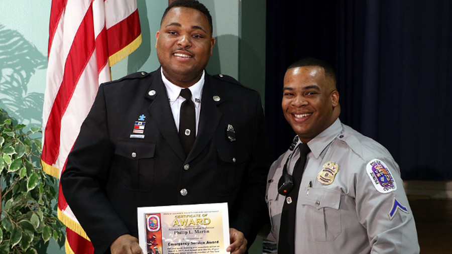EMT Phil Martin, left, and Officer Ricardo Biddy