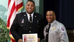 EMT Phil Martin, left, and Officer Ricardo Biddy EMT Phil Martin, left, and Officer Ricardo Biddy