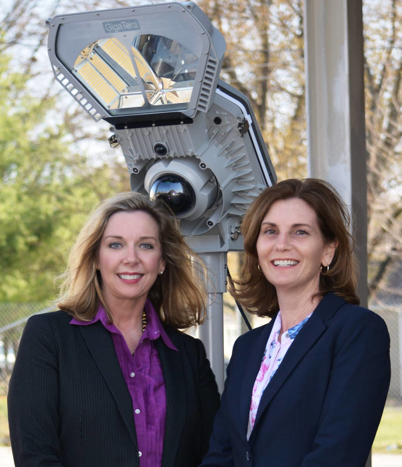Laura Jones, CEO, Regent Power, LLC and Kathleen Griggs, President, Databuoy Corporation stand in front of the Smart City Streetlight