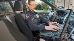 An officer on the campus of Davidson College, Davidson, N.C., accessing records on the Report Exec RMS software program in her police cruiser. Davidson College has integrated software from Maxient with Report Exec, which expressly helps schools comply with regulatory requirements like the Clery Act.