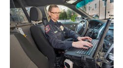 An officer on the campus of Davidson College, Davidson, N.C., accessing records on the Report Exec RMS software program in her police cruiser. Davidson College has integrated software from Maxient with Report Exec, which expressly helps schools comply with regulatory requirements like the Clery Act.