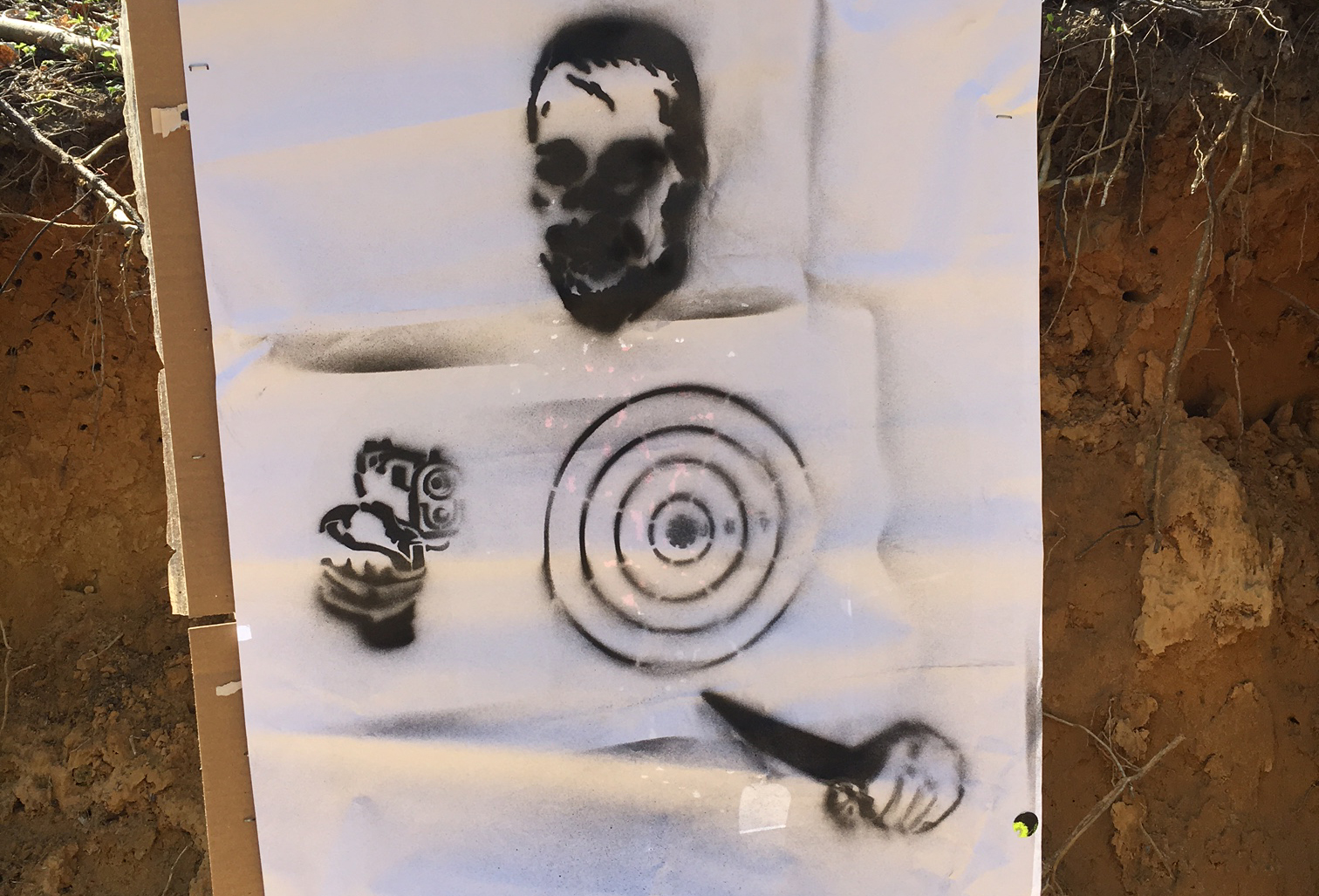 You can see what happens if the paper isn't flat when you spray the target(s). That's a pretty blurred zombie head - but not because of the stencil; because of the user's improper set up and planning.