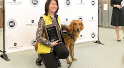 Denise Corliss accepting 2017 Empire State Award for Canine Excellence (ACE) on behalf of her fallen partner Bretagne. Denise is seen here with her current partner, Taser.