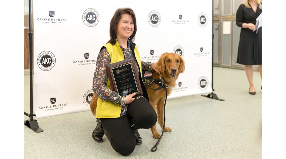 Denise Corliss accepting 2017 Empire State Award for Canine Excellence (ACE) on behalf of her fallen partner Bretagne. Denise is seen here with her current partner, Taser.
