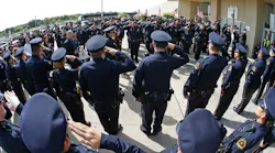 The family of officer Zamarippa arrives for the funeral, entering through a corridor of Dallas Police at Wilkerson-Greines Activity Center Saturday, July 16, 2016 in Fort Worth, Texas.