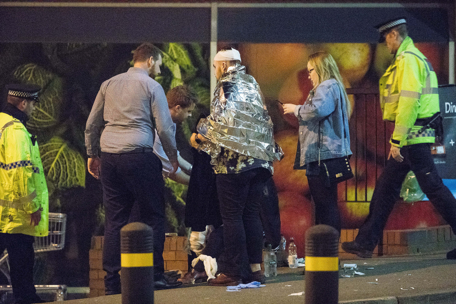 Police and other emergency services are seen near the Manchester Arena on Monday, May 22, 2017 at the Manchester Arena in Manchester, England after reports of an explosion. Manchester police reported 'a number of confirmed fatalities and others injured' as hundreds fled the arena following an Ariana Grande concert at the venue.