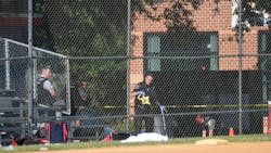 Police work at the site of the gunshot at Eugene Simpson Stadium Park in Alexandria, Virginia on June 14, 2017. Steve Scalise, a U.S. House Republican leader, was among possibly five people shot by a gunman Wednesday morning as he was playing baseball game with other congressmen and aides.