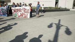 Protestors show their opposition to the LAPD getting drones on Aug. 8, 2017 in Los Angeles. They felt the money could be re-invested in the community.