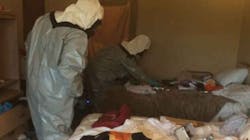 Police officers search a hotel room in Arlington, Wash., August 14, 2017. Three officers had to go to the hospital after a violent reaction to heroin smoke. Police officers search a hotel room in Arlington, Wash., August 14, 2017. Three officers had to go to the hospital after a violent reaction to heroin smoke.