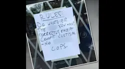 A sign posted in front of a gym in Atlanta has outraged police officers and community members alike.