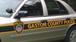 Multiple shots were fired into a Gaston County Police officer&apos;s home outside Cherryville just after the officer got off duty Monday morning.