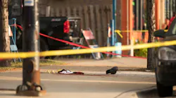Evidence markers surround bloody clothes near the scene of a shooting at the intersection of West 24th Street and South Western Avenue, Sunday, September 17, 2017, on the Lower West Side of Chicago.