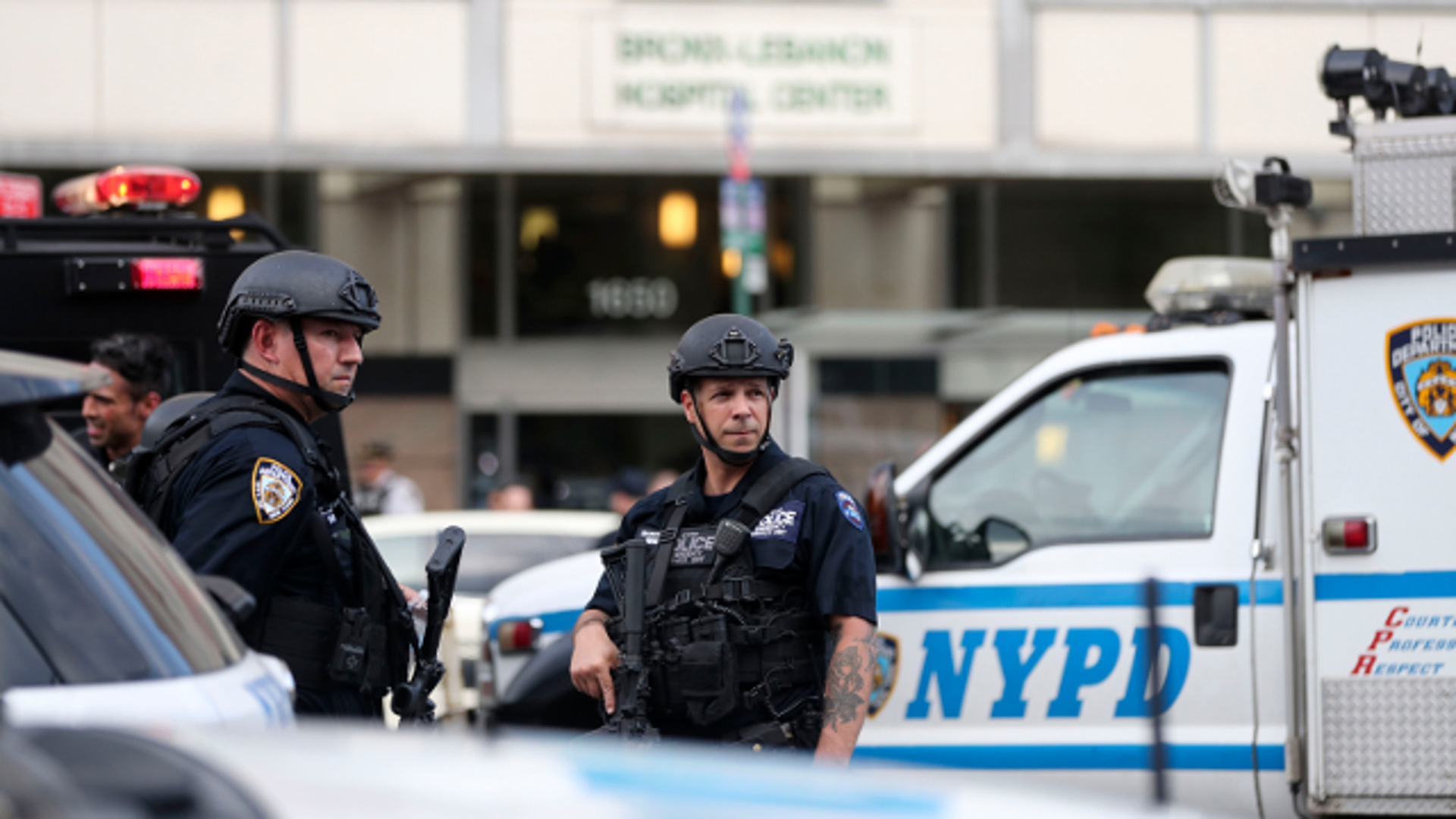 Police officers stand guard outside Bronx Lebanon Hospital in New York on Friday, June 30, 2017.