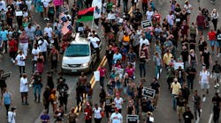 Protesters march east on Olive Street toward the St. Louis Police Department headquarters on Sunday, Sept. 17, 2017.