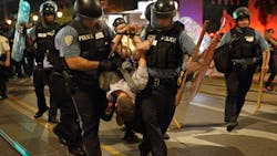 Police officers arrest a man during the later protest on Delmar Boulevard in University City on Saturday, Sept. 16, 2017.