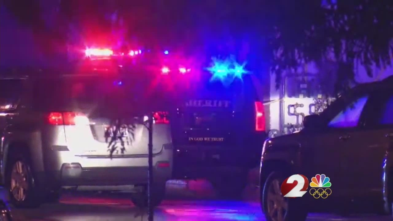 Locals react to photographer shot by officer