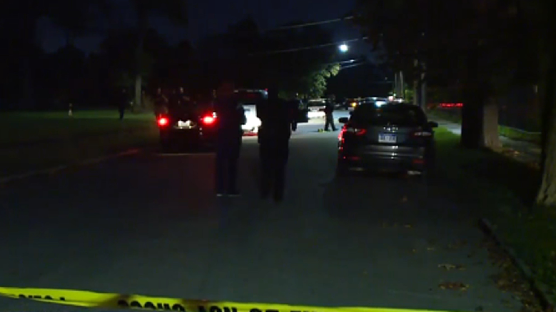 Two Detroit police officers sitting in their marked patrol car looking for stolen vehicles were ambushed by gunmen Wednesday night.