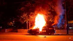 A Georgia Tech Police patrol car is seen on fire on Sept. 18 in Atlanta as violence breaks out during a vigil for a student fatally shot by an officer. A Georgia Tech Police patrol car is seen on fire on Sept. 18 in Atlanta as violence breaks out during a vigil for a student fatally shot by an officer.