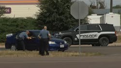 Two police officers were injured in an unusual incident involving a stolen vehicle and a police dog Tuesday. Two police officers were injured in an unusual incident involving a stolen vehicle and a police dog Tuesday.