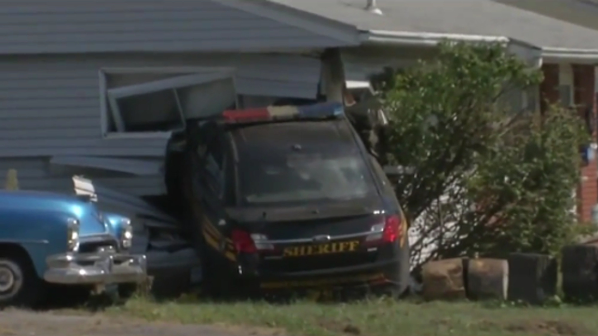 A vehicle cut in front of a Franklin County Sheriff's patrol car Tuesday, causing a crash that ended up with the cruiser smashing into a house.