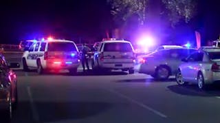 A Phoenix police officer was saved by his ballistic vest after he was shot during an exchange of gunfire with a suspect Wednesday night.