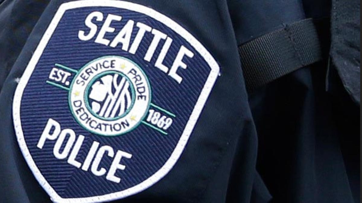 The FBI is investigating allegations that Seattle police officers may have engaged in intimidation and price- fixing while working off-duty jobs directing traffic at parking garages and construction sites.