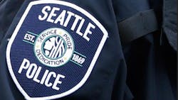The FBI is investigating allegations that Seattle police officers may have engaged in intimidation and price- fixing while working off-duty jobs directing traffic at parking garages and construction sites.