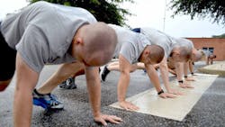 Members of the Virginia State Police&apos;s 126th Basic Session take part in physical training exercises.