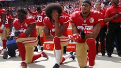 From left, San Francisco 49ers' Eli Harold (58), quarterback Colin Kaepernick (7) and Eric Reid (35) kneel during the national anthem before their NFL game against the Dallas Cowboys on Sunday, Oct. 2, 2016 in Santa Clara, Calif. From left, San Francisco 49ers' Eli Harold (58), quarterback Colin Kaepernick (7) and Eric Reid (35) kneel during the national anthem before their NFL game against the Dallas Cowboys on Sunday, Oct. 2, 2016 in Santa Clara, Calif.