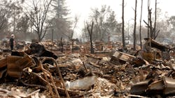 Christopher Osborne, 16, looks over the firestorm ruins in the Coffee Park neighborhood of Santa Rosa, Calif. on Wednesday, Oct. 18, 2017.