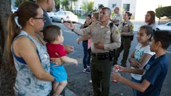 Los Angeles County Sheriff's Deputy Marino Gonzalez, center, talks with community members during a block meeting in Cudahy, Calif., on June 27, 2017. Los Angeles County Sheriff's Deputy Marino Gonzalez, center, talks with community members during a block meeting in Cudahy, Calif., on June 27, 2017.