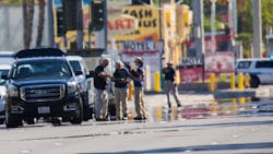 Heat waves ripple in the afternoon sun as investigators work the scene near the Route 91 Harvest country music festival, two days after a lone gunman opened fire onto the festival from the 32nd floor of the Mandalay Bay Hotel, killing 59 and wounding 527 people, on Tuesday, Oct. 3, 2017, in Las Vegas.