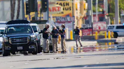 Heat waves ripple in the afternoon sun as investigators work the scene near the Route 91 Harvest country music festival, two days after a lone gunman opened fire onto the festival from the 32nd floor of the Mandalay Bay Hotel, killing 59 and wounding 527 people, on Tuesday, Oct. 3, 2017, in Las Vegas.